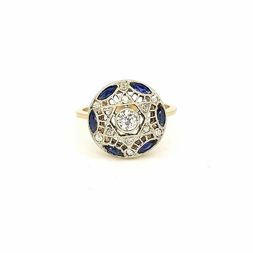 Vintage Sapphire and Diamond Circular Star Cluster Ring; central diamond surrounded by marquise-cut sapphires and round-cut diamonds, star design, pierced mount, in 18ct yellow gold