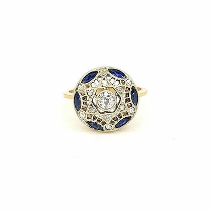 Vintage Sapphire and Diamond Circular Star Cluster Ring; central diamond surrounded by marquise-cut sapphires and round-cut diamonds, star design, pierced mount, in 18ct yellow gold