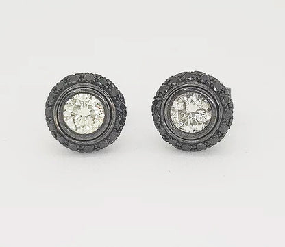 White and Black Diamond Halo Detachable Stud Earrings; 0.80cts white round brilliant-cut diamonds surrounded by 0.96cts carved black diamond