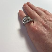 Retro Diamond and Platinum Cocktail Ring; designed as a dome with curved and flaring ridges, set with 2.55 carats round brilliant cut and baguette diamonds