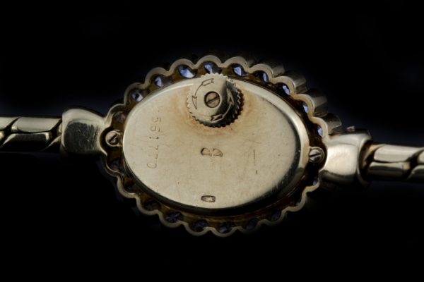 Vintage Vacheron Constantin 18ct Yellow Gold Watch with Diamonds and Emeralds; solid 18ct gold ladies manual wristwatch with diamond bezel accented with emerald set terminals. Made in Switzerland, Circa 1950s