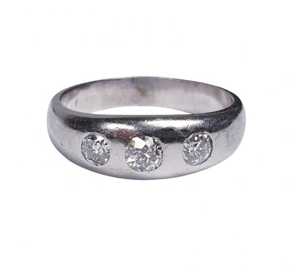 Vintage Old Cut Diamond and Platinum Three Stone Ring; classic gypsy ring featuring three old mine cut diamonds set into a platinum band, 1.00 carat total, Circa 1930s