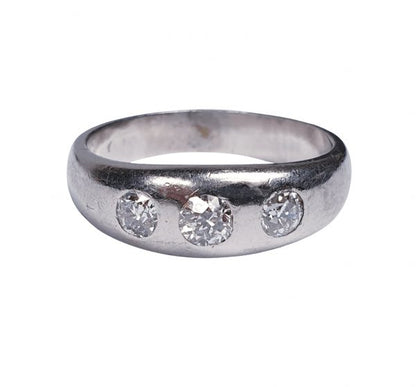 Vintage Old Cut Diamond and Platinum Three Stone Ring; classic gypsy ring featuring three old mine cut diamonds set into a platinum band, 1.00 carat total, Circa 1930s