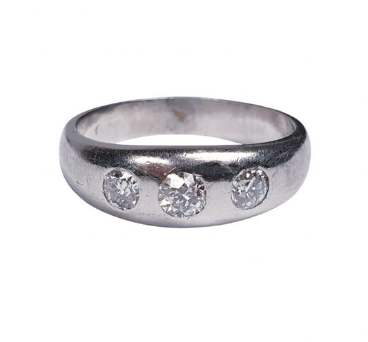 Vintage Old Cut Diamond and Platinum Three Stone Ring; classic gypsy ring featuring three old mine cut diamonds set into a platinum band, 1.00 carat total, Circa 1930s