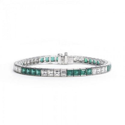 Princess Cut Emerald and Diamond Line Bracelet; channel set with alternating sets of four square-cut emeralds and four step-cut diamonds. Emeralds 8.22 carats, Diamonds 6.69 carats