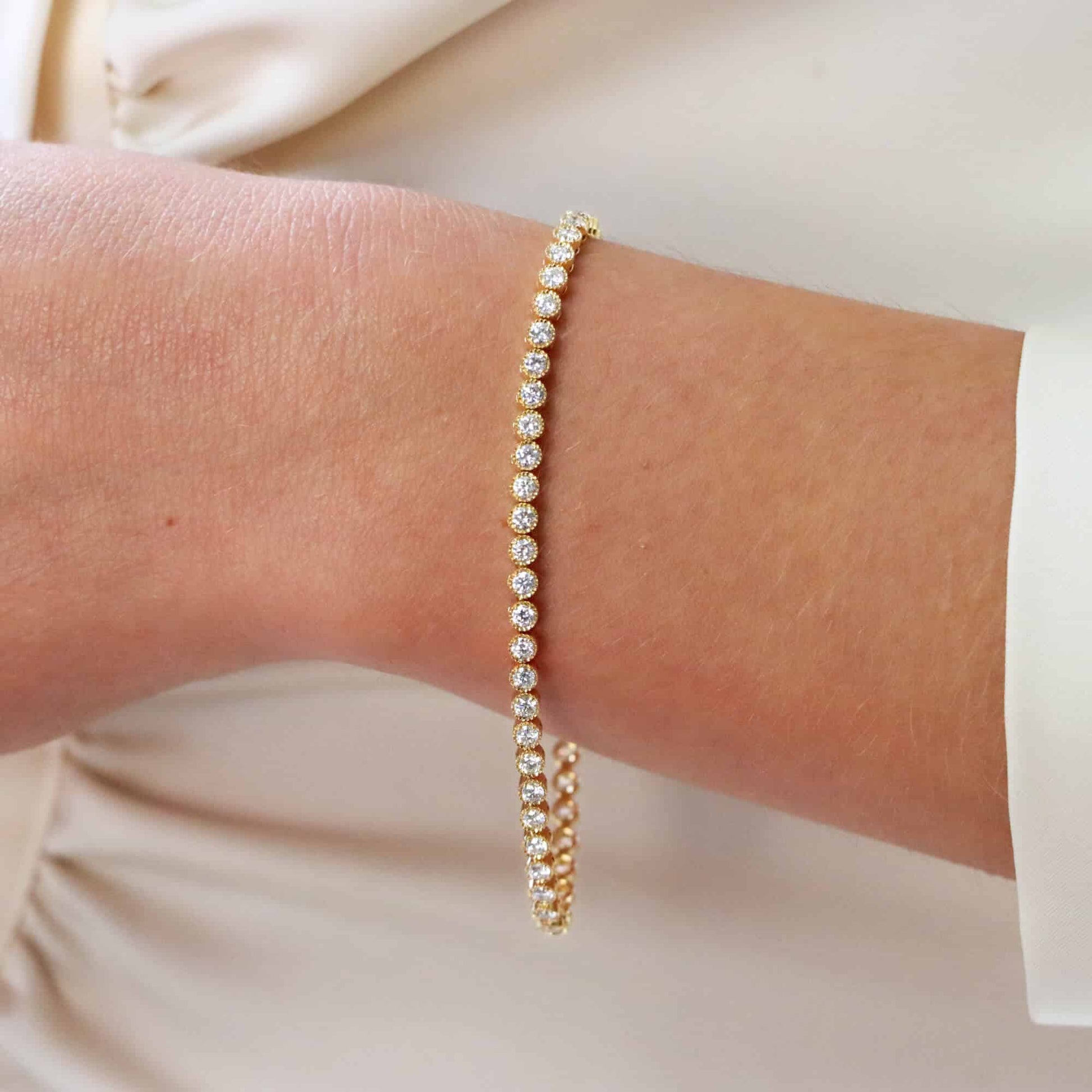 Rub Over Diamond Line Bracelet in 18ct Yellow Gold, 2.88 carat total, 55 round brilliant cut diamonds bezel set in yellow gold, G/H colour with VVS clarity