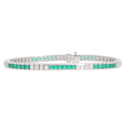 Contemporary 18ct white gold scissor cut emeralds and french cut diamonds line tennis bracelet