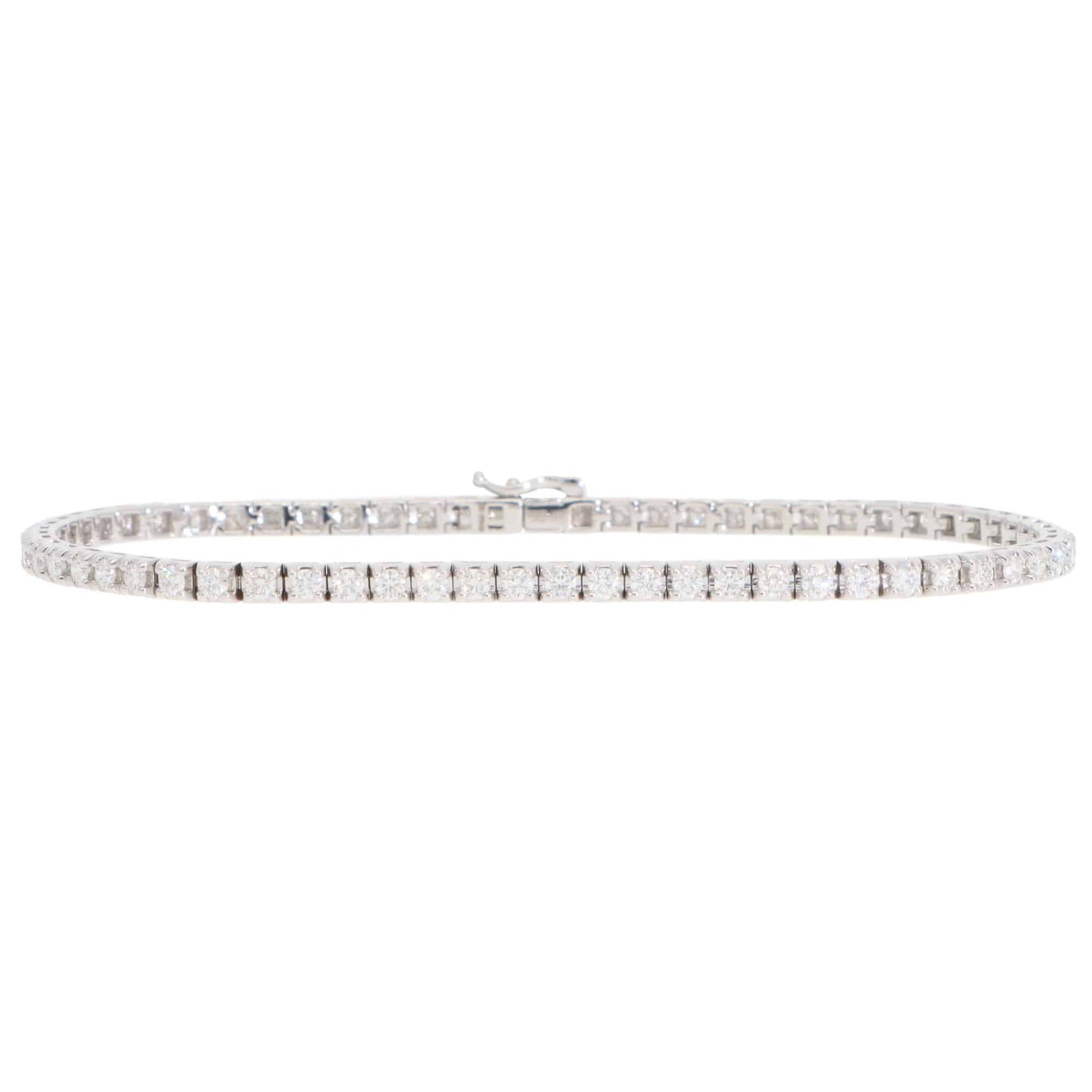 A white gold diamond line bracelet, on a white background