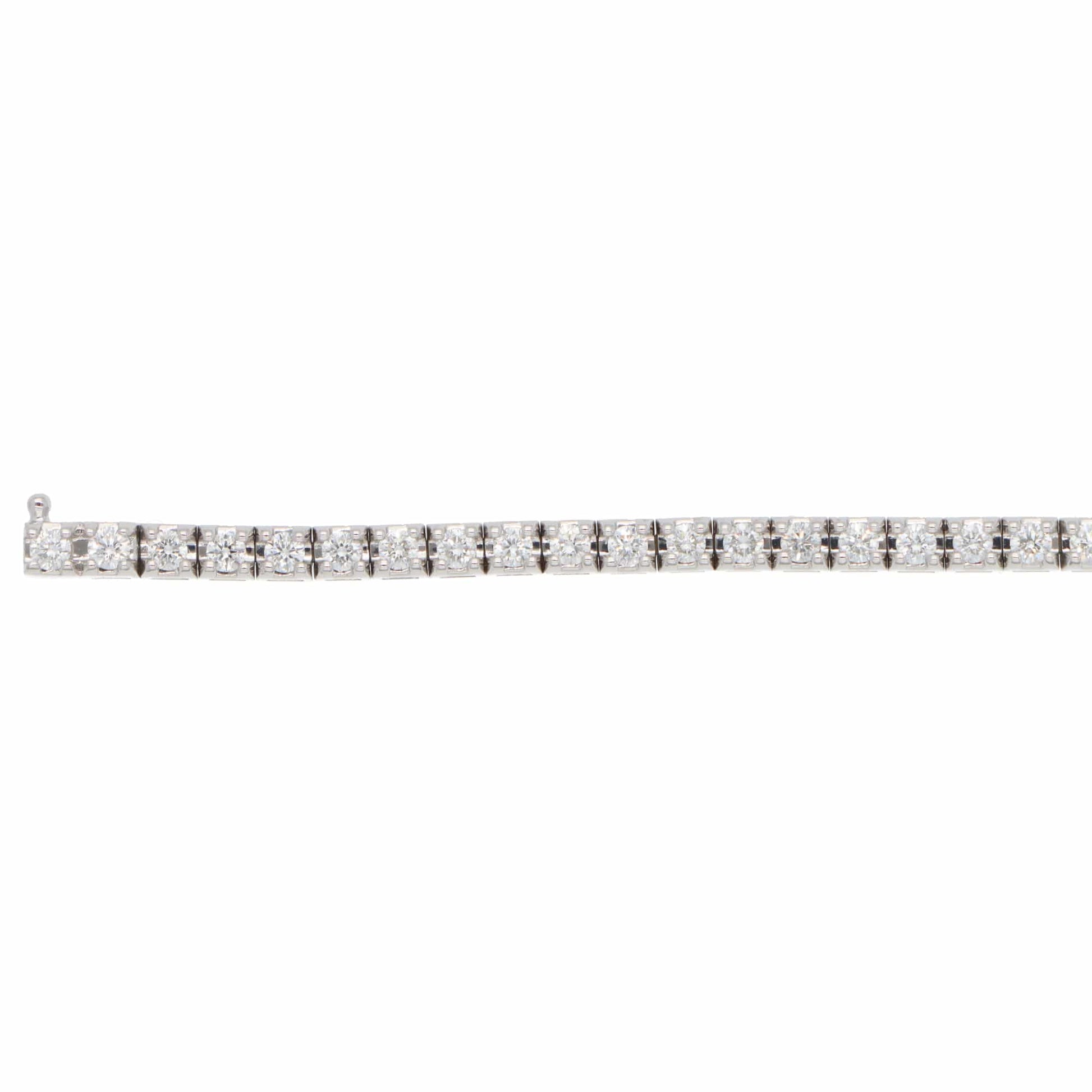 A white gold diamond line bracelet, on a white background