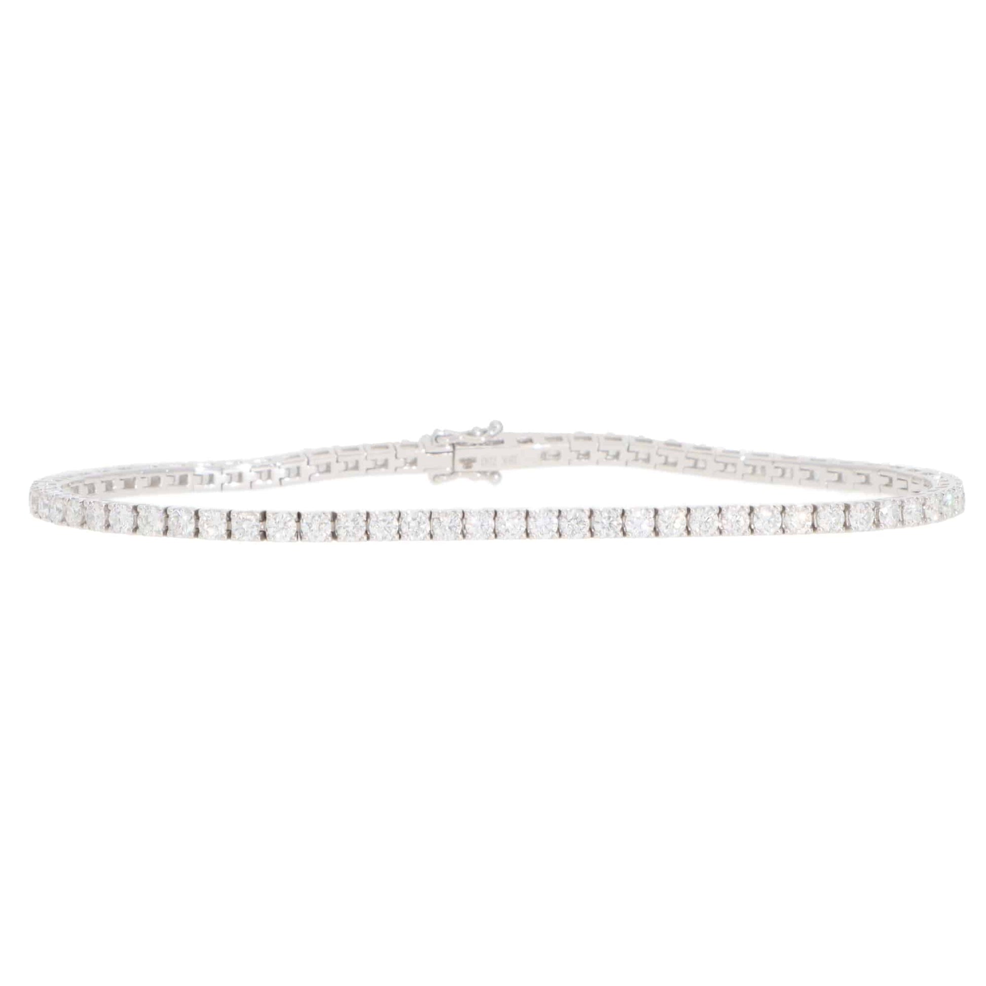 A white gold diamond line bracelet, on a white background