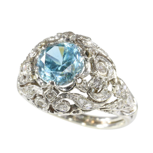 A round blue zircon and diamond openwork ring in platinum