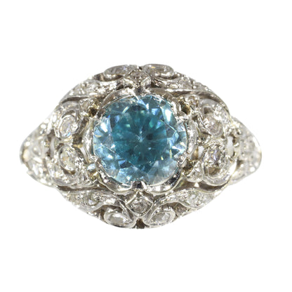 A round blue zircon and diamond openwork ring in platinum