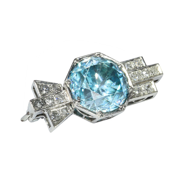 A blue zircon and diamond geometric designed brooch in platinum