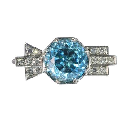 A blue zircon and diamond geometric designed brooch in platinum