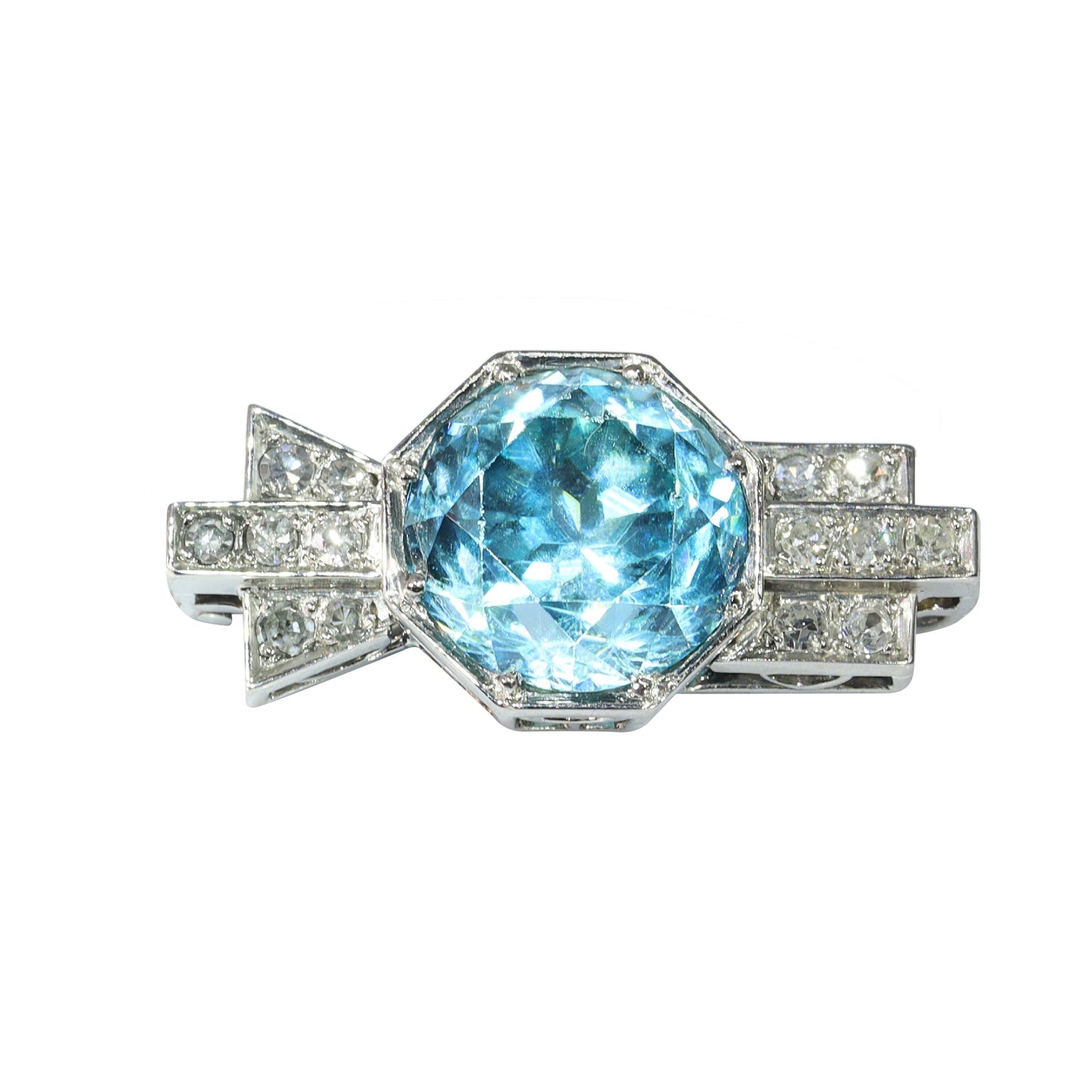 A blue zircon and diamond geometric designed brooch in platinum