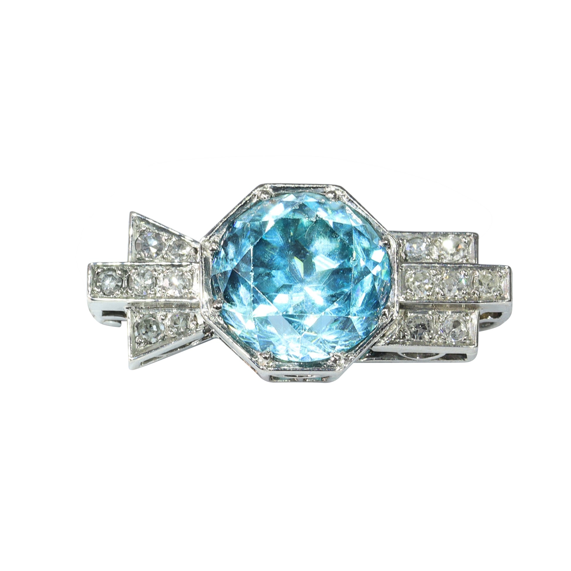 A blue zircon and diamond geometric designed brooch in platinum