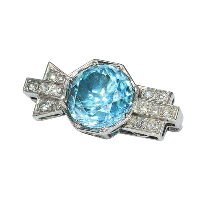 A blue zircon and diamond geometric designed brooch in platinum