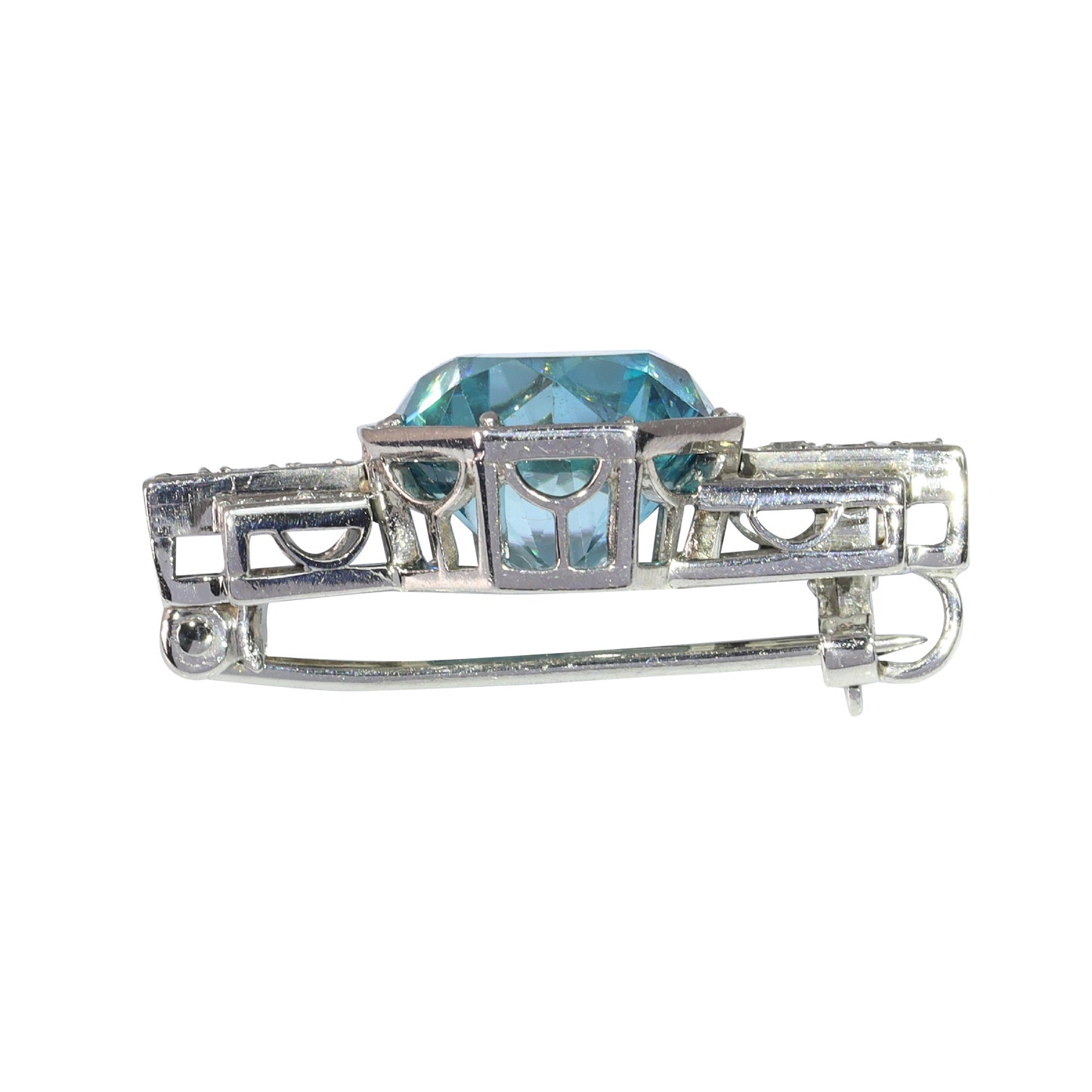 A blue zircon and diamond geometric designed brooch in platinum