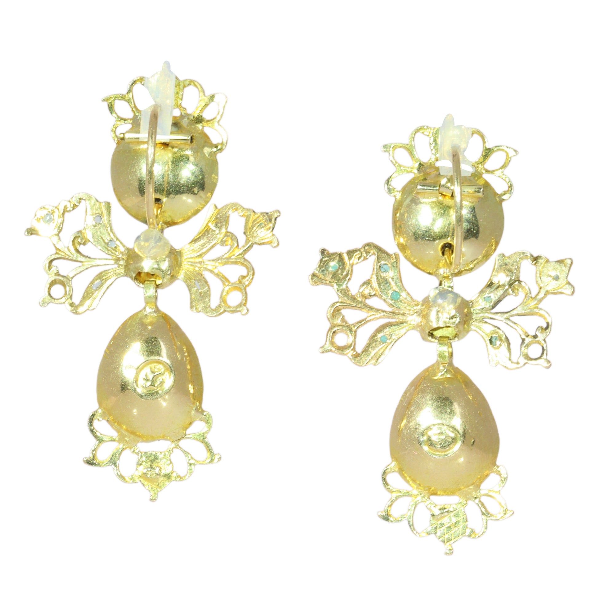 A pair of intricate yellow gold pendant drop earrings set with emeralds