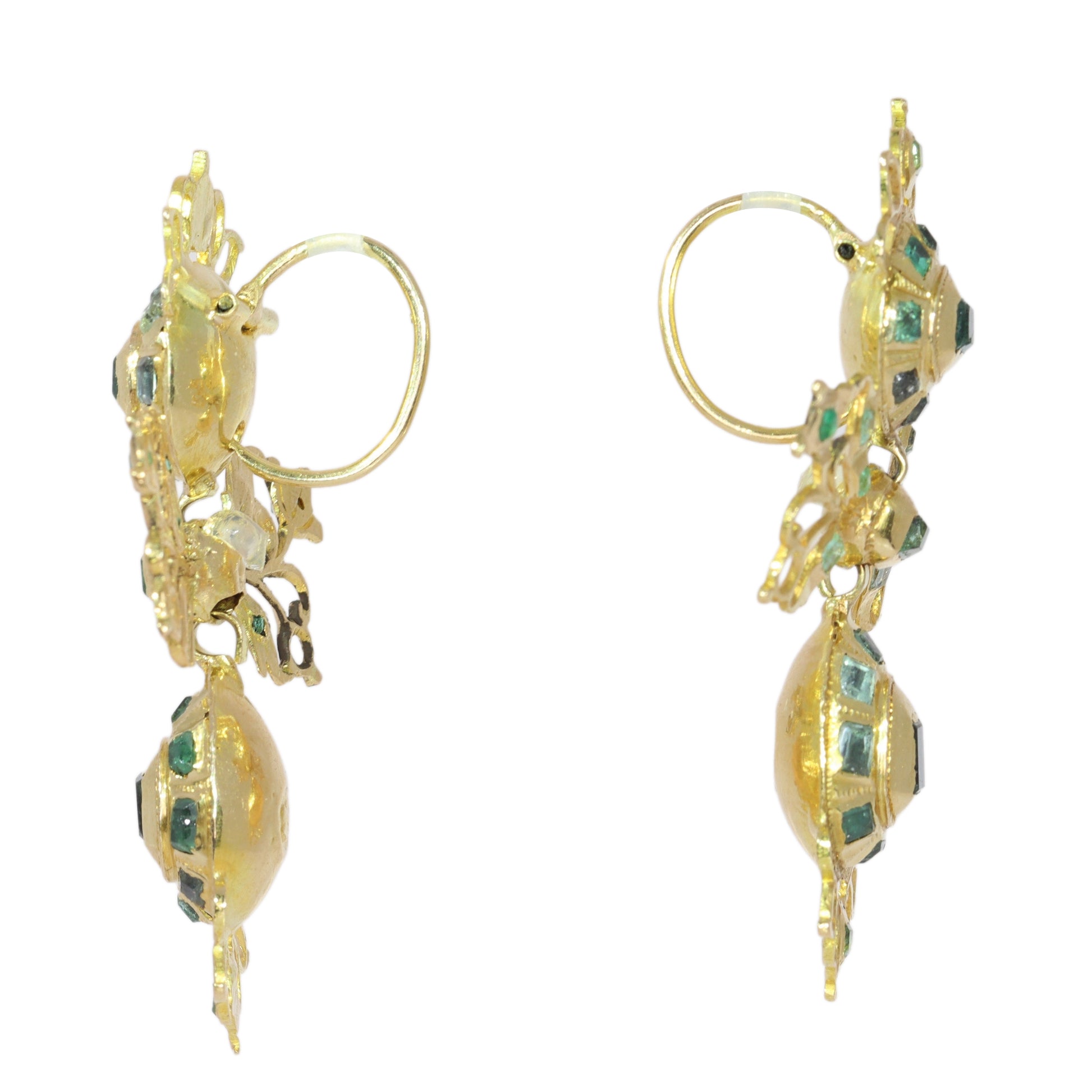 A pair of intricate yellow gold pendant drop earrings set with emeralds
