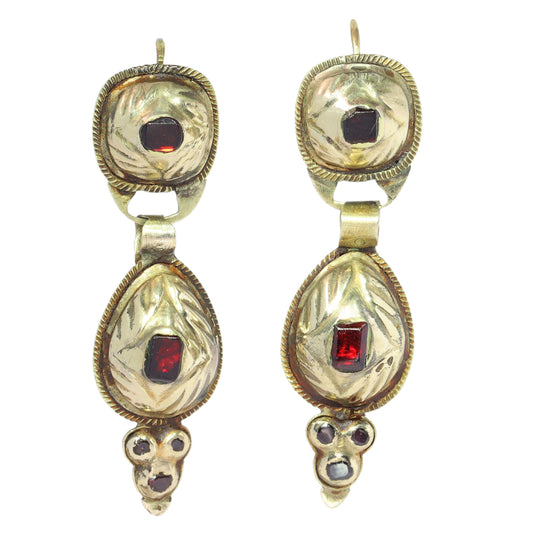 A pair of antique yellow gold double drop earrings with garnets