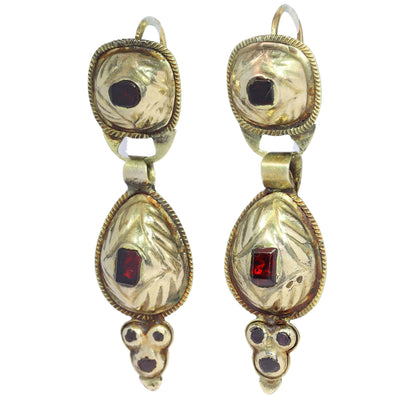 A pair of antique yellow gold double drop earrings with garnets