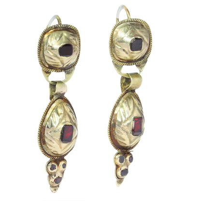 A pair of antique yellow gold double drop earrings with garnets