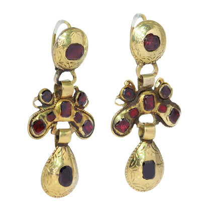 A pair of Iberian drop earrings in yellow gold with garnets