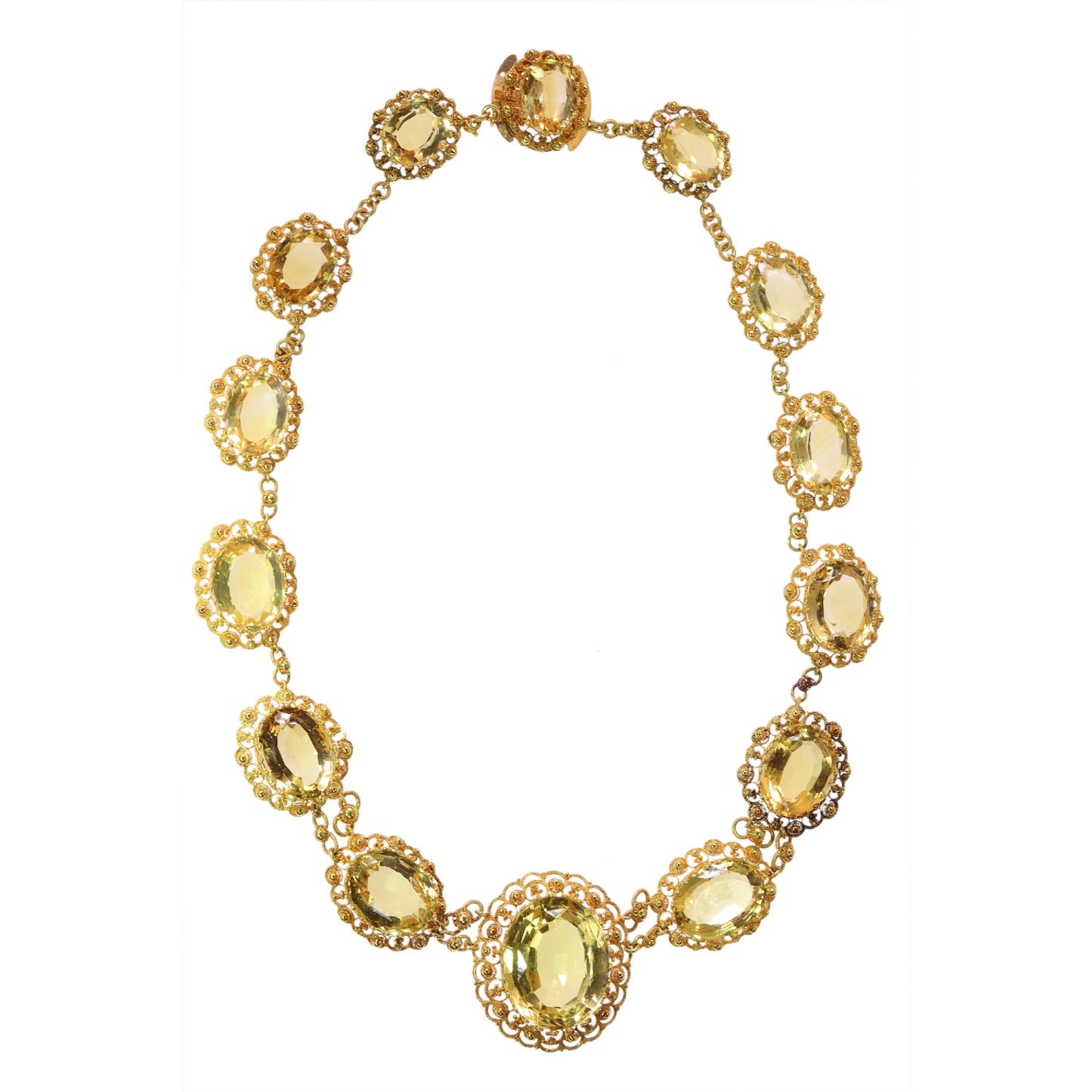 An intricate yellow gold necklace set with oval citrines in filigree mounts