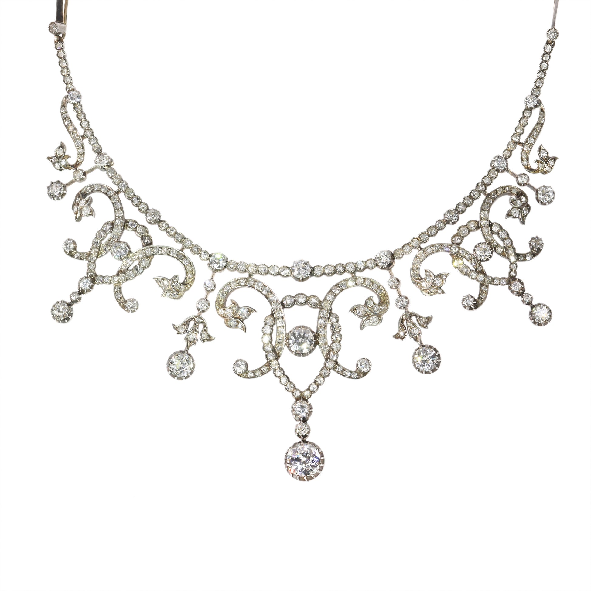 An intricate diamond fringe collar necklace with diamond pendant drops