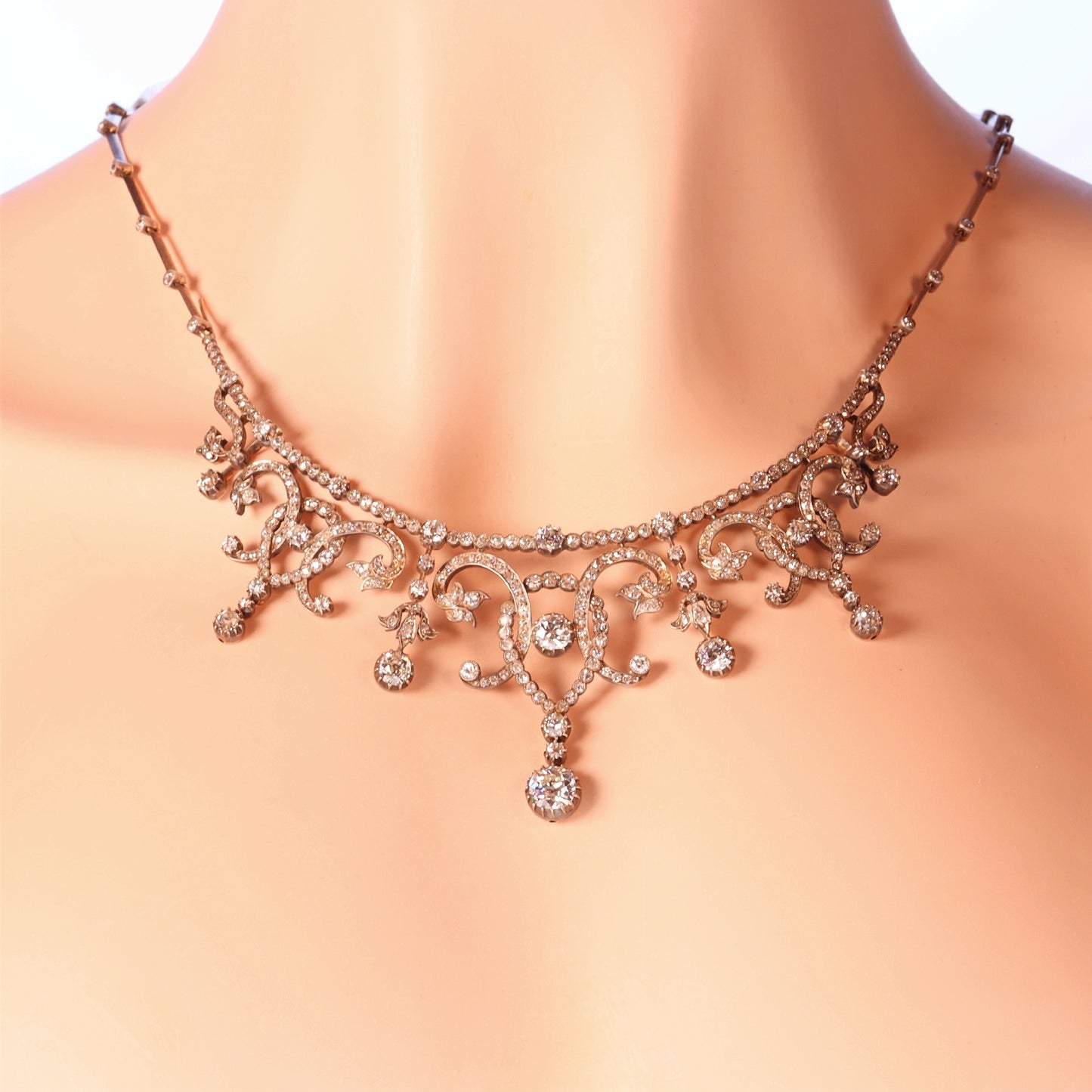 An intricate diamond fringe collar necklace with diamond pendant drops, modelled on a neck