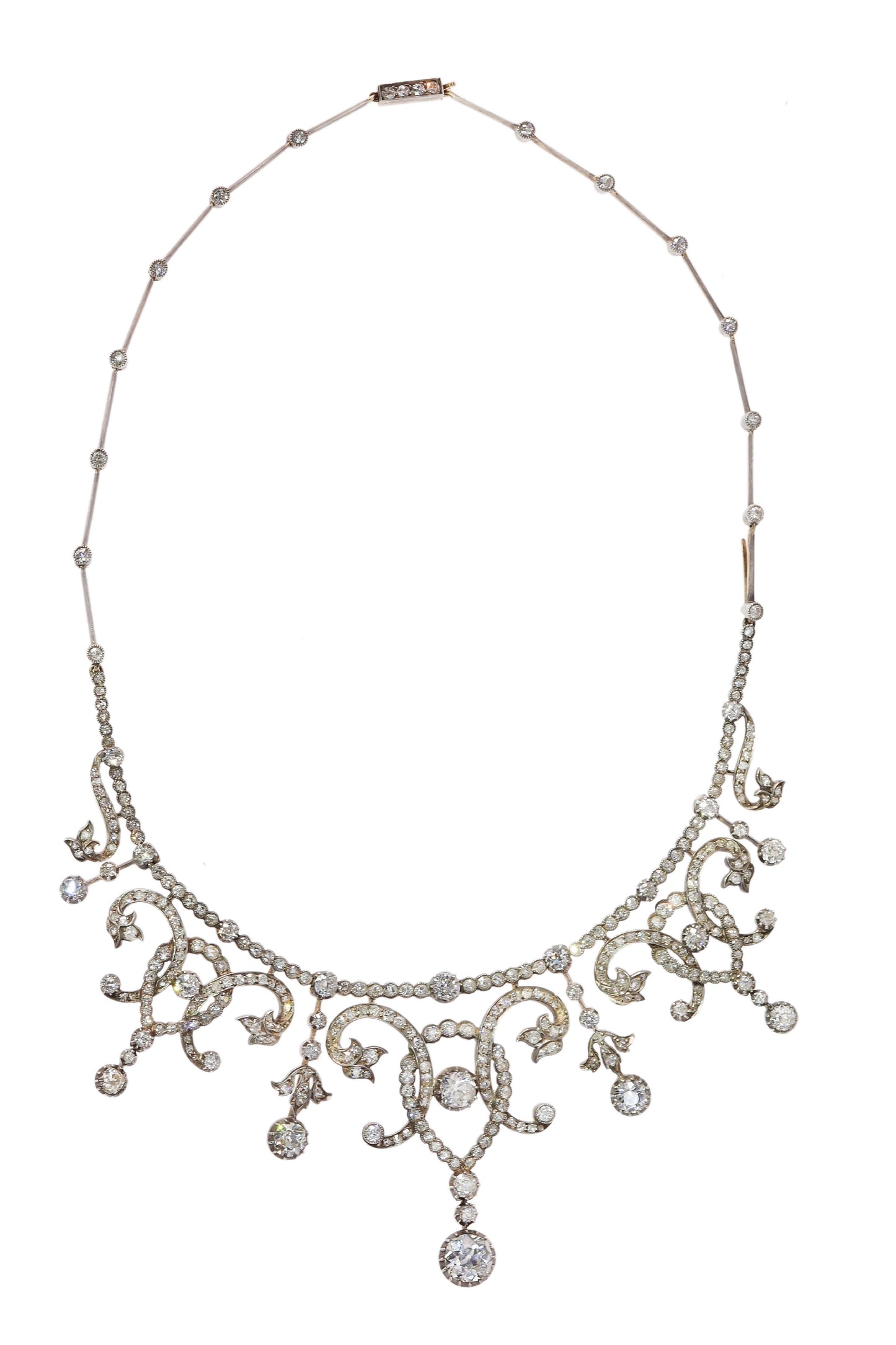 An intricate diamond fringe collar necklace with diamond pendant drops