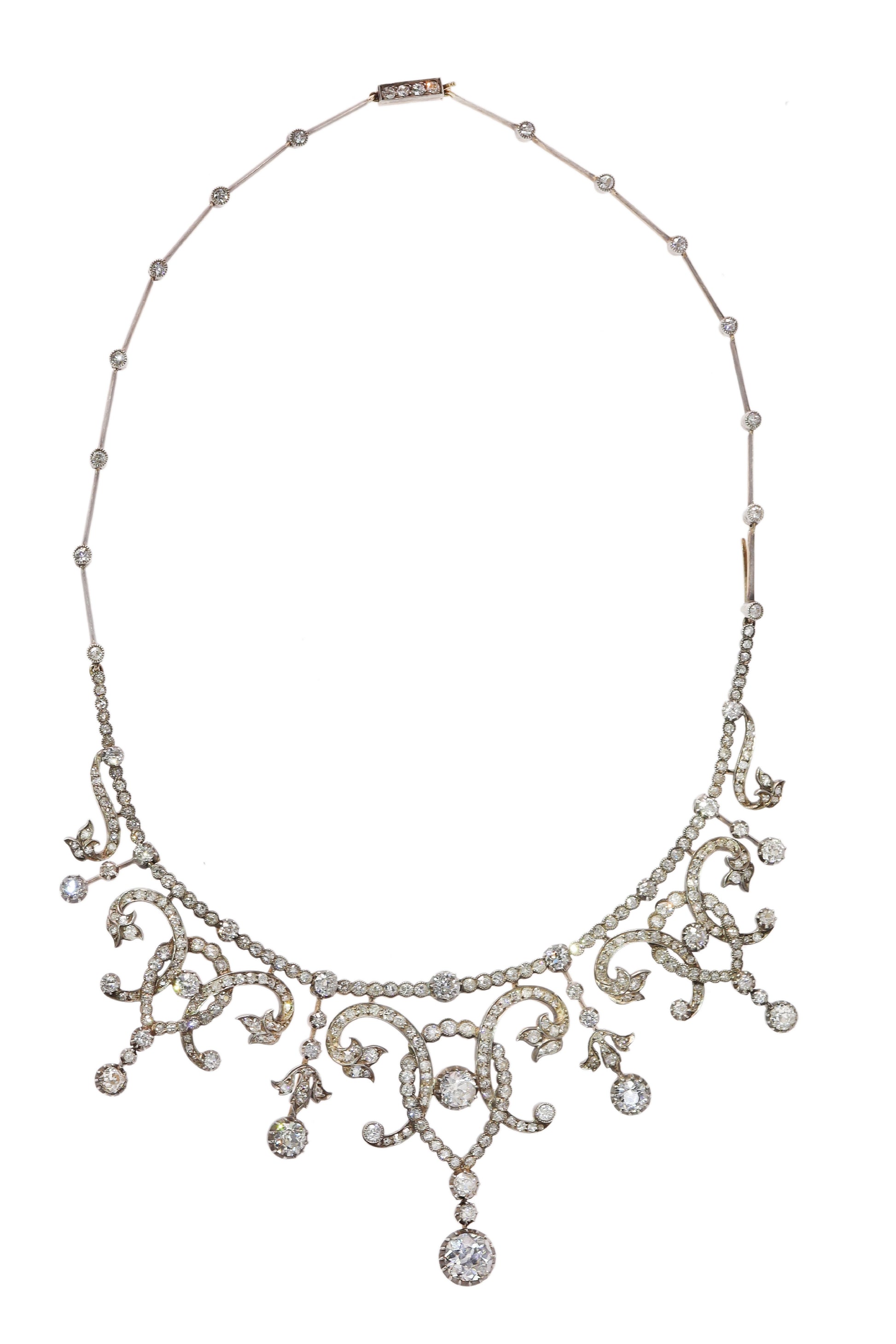 An intricate diamond fringe collar necklace with diamond pendant drops