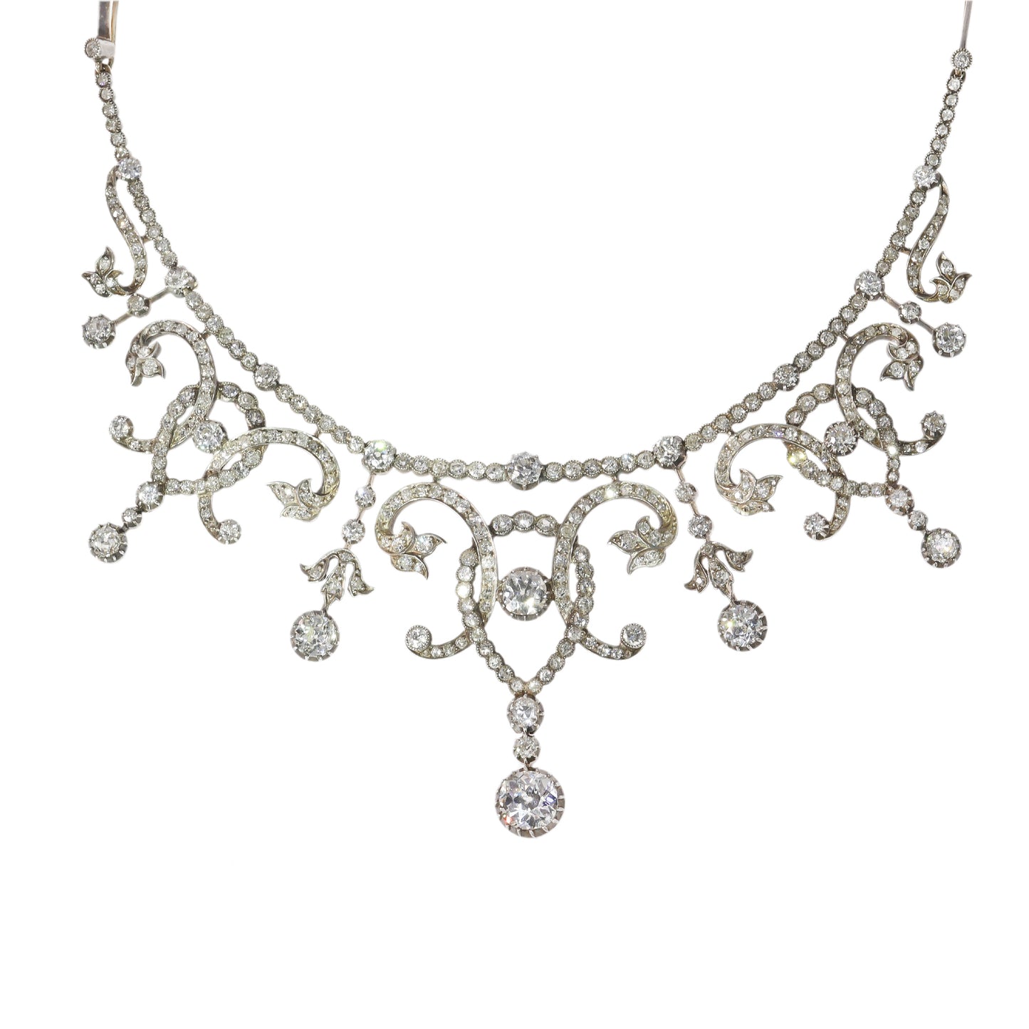 An intricate diamond fringe collar necklace with diamond pendant drops