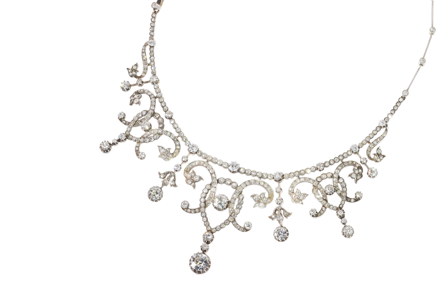 An intricate diamond fringe collar necklace with diamond pendant drops
