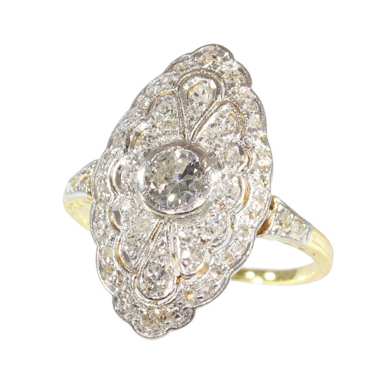 A navette shaped cluster ring set with diamonds in yellow and white gold
