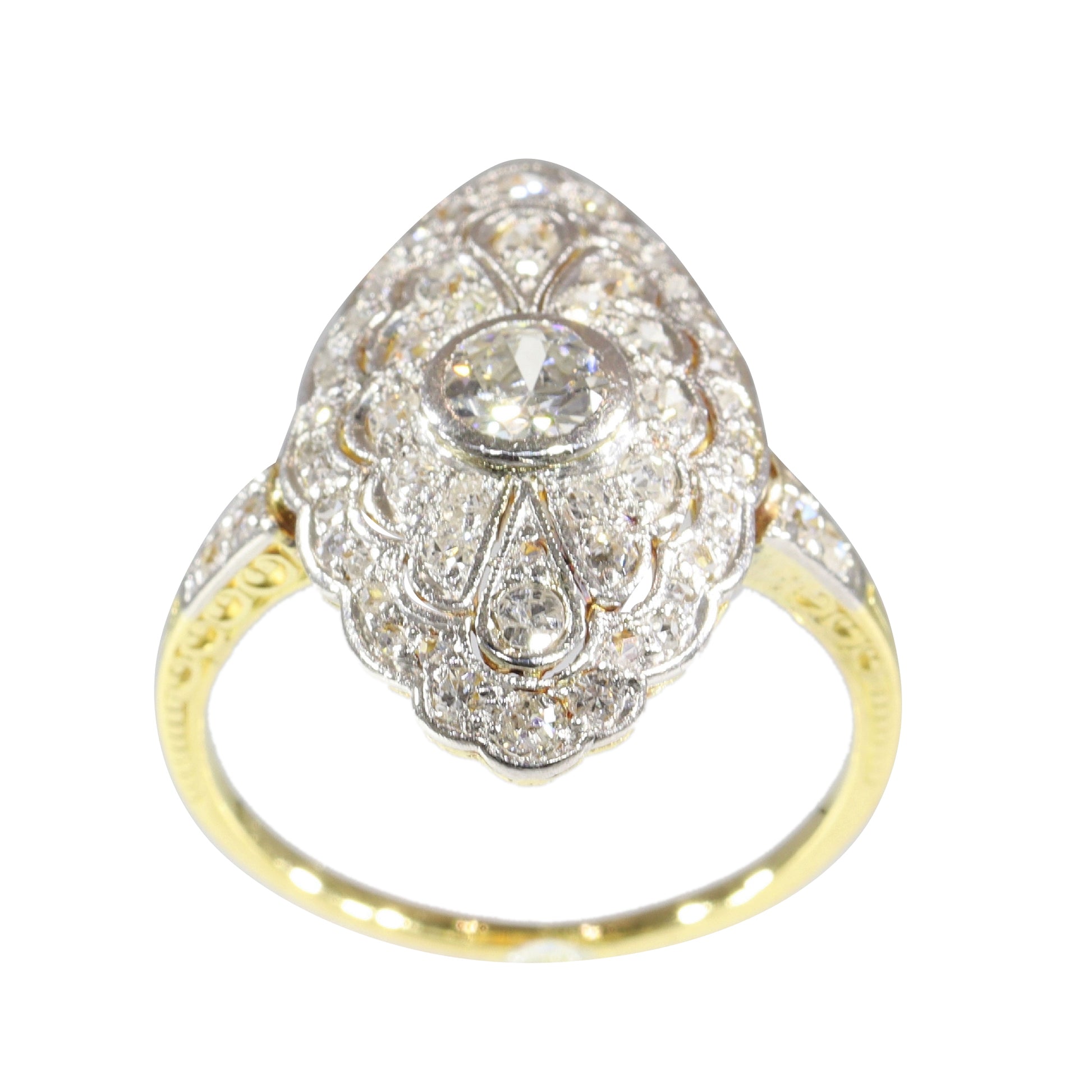 A navette shaped cluster ring set with diamonds in yellow and white gold