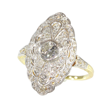 A navette shaped cluster ring set with diamonds in yellow and white gold