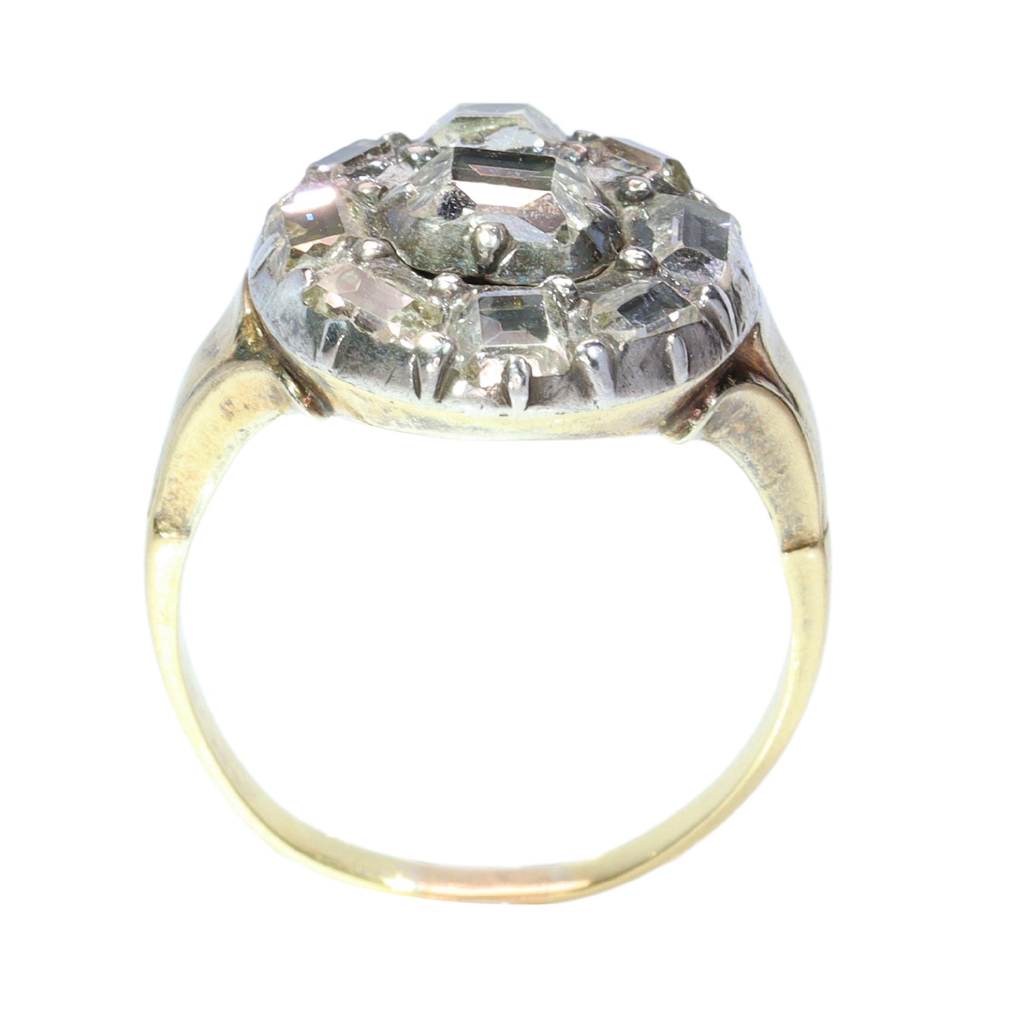 An antique circular cluster ring with table cut diamonds, in gold and silver