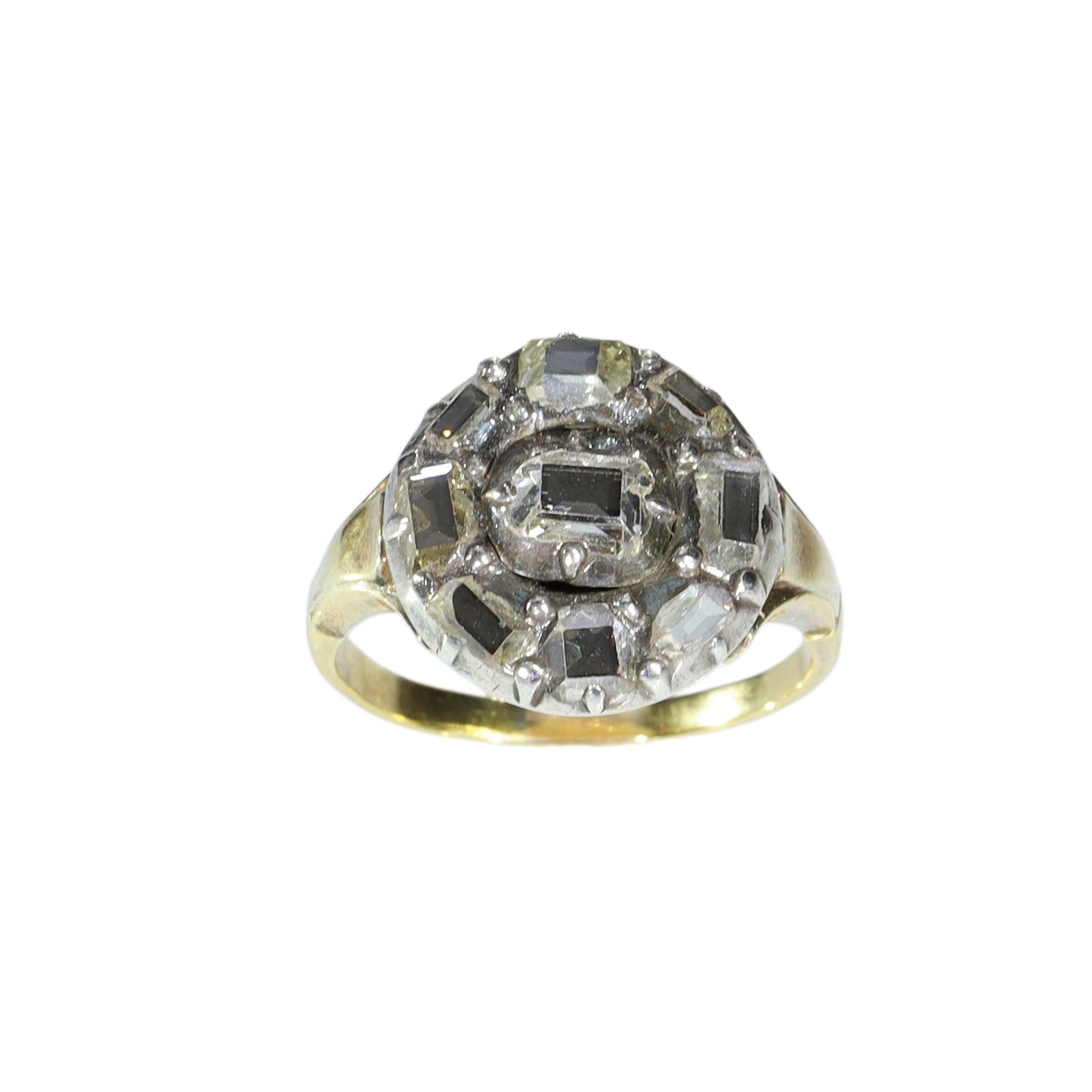 An antique circular cluster ring with table cut diamonds, in gold and silver