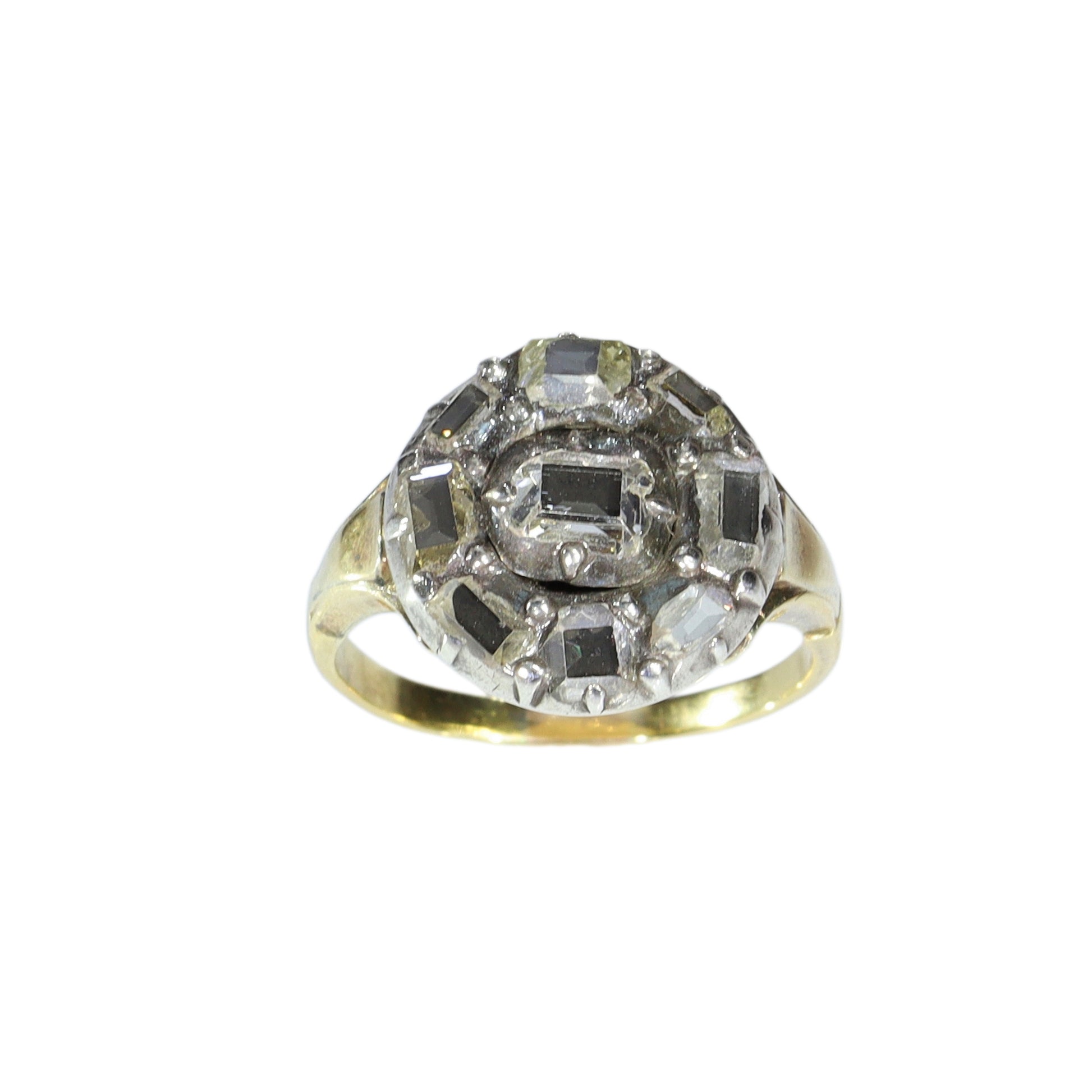 An antique circular cluster ring with table cut diamonds, in gold and silver