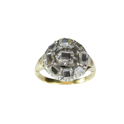 An antique circular cluster ring with table cut diamonds, in gold and silver