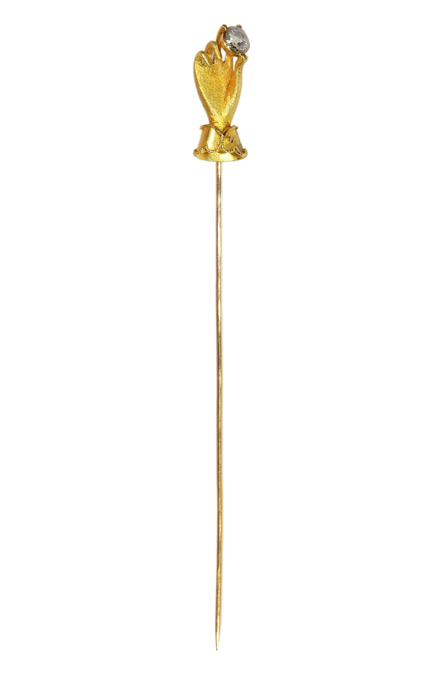 A yellow gold hand holding a diamond stick or tie pin