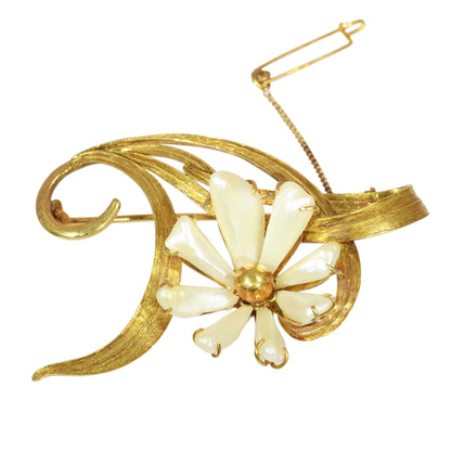 An antique yellow gold flower brooch with elongated white pearls