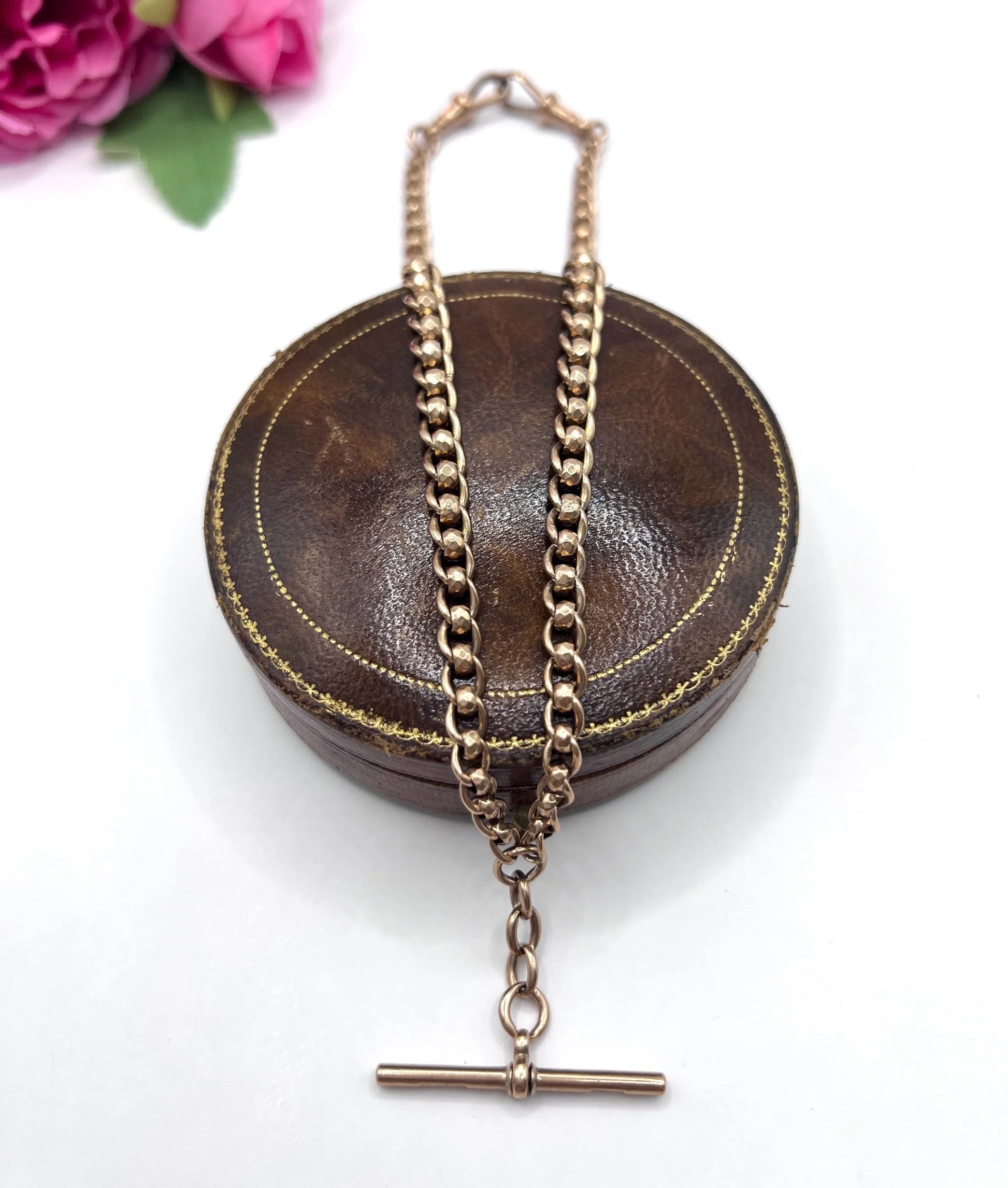 A rose gold fancy link Albert chain necklace with a T-bar attachment