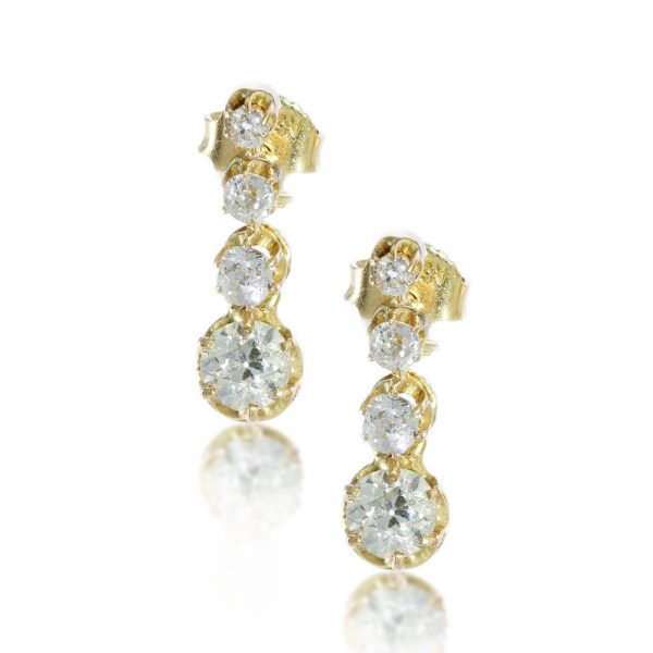 Vintage Diamond Drop Earrings in 18ct Yellow Gold; set with 1.20 carats spectacular sparkling old round brilliant cut diamonds. Circa 1940s