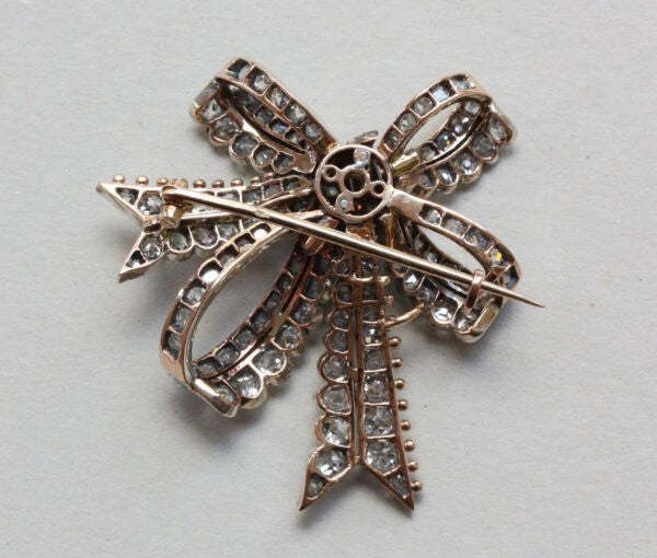Antique Victorian Old Cut Diamond Double Bow Brooch, 3.40 carat total, in silver and gold, Circa 1880.