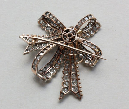 Antique Victorian Old Cut Diamond Double Bow Brooch, 3.40 carat total, in silver and gold, Circa 1880.