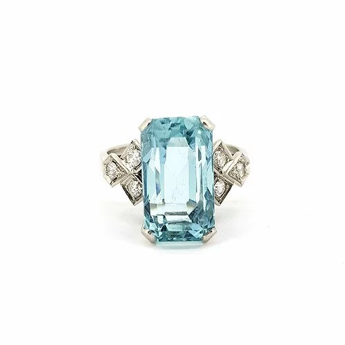 Vintage Emerald Cut Aquamarine and Diamond Ring; emerald-cut aquamarine flanked either side by three brilliant cut diamonds, in 18ct white gold, Circa 1950s