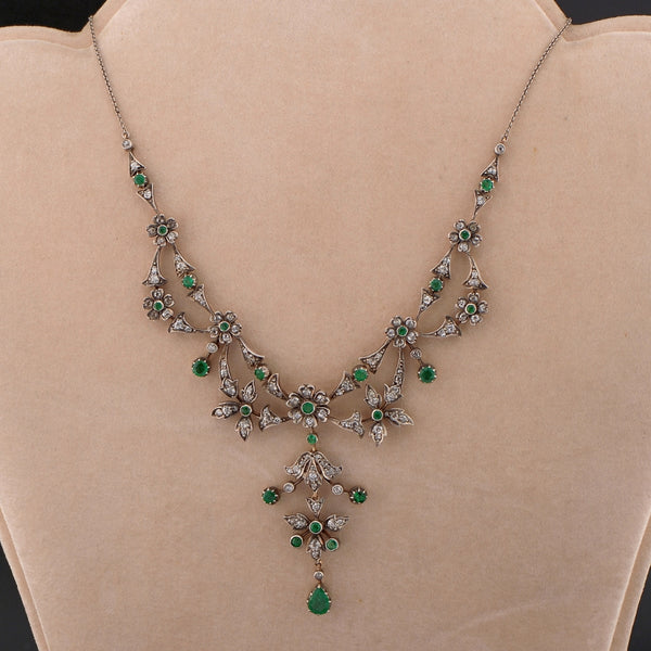 Victorian Antique Emerald and Diamond Floral Cluster Necklace, comprised of flower clusters set throughout with luxurious jungle green round and pear-cut natural emeralds and sparkling old mine-cut diamonds in silver upon 18ct gold. Circa 1870
